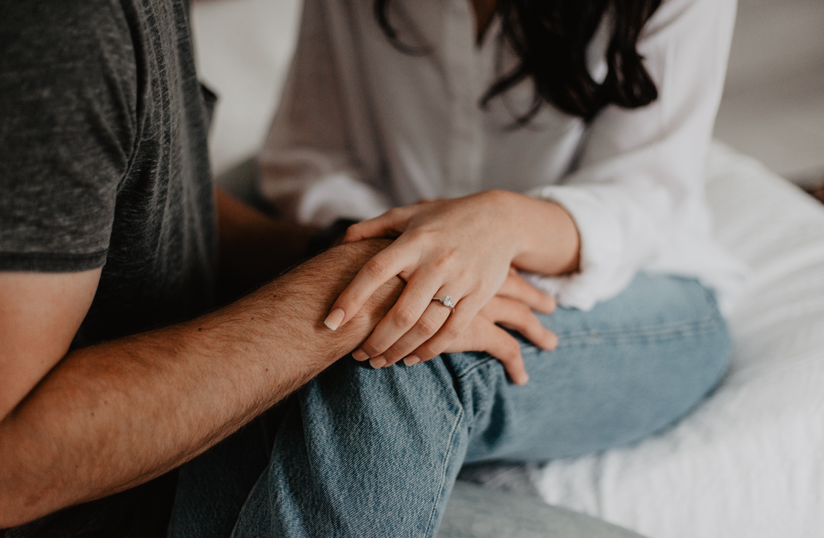 couple holding hands 