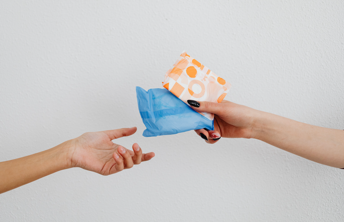 two hands passing each other pads