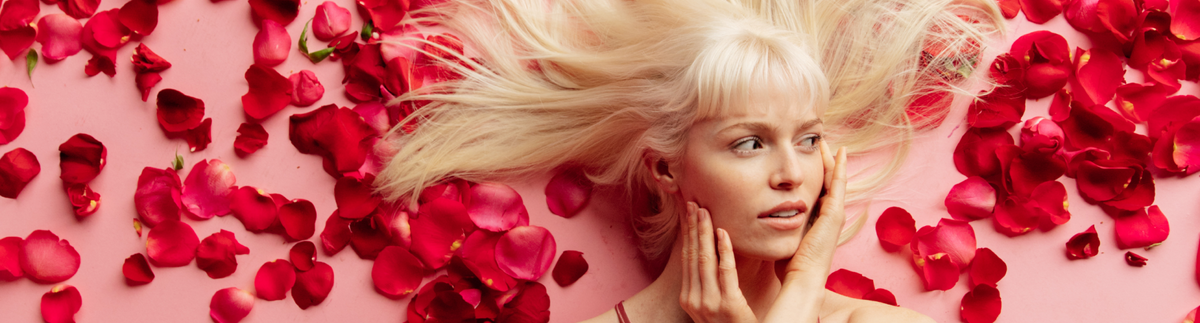 woman laying in rose petals